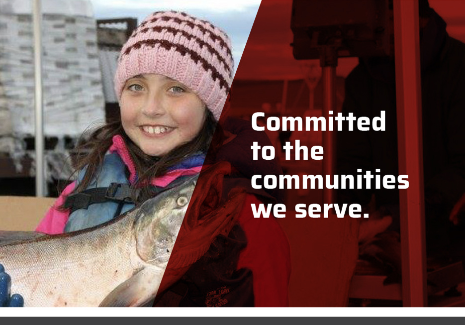 Committed to the Communities We Serve. A photo of an Alaskan girl holding a fish. 