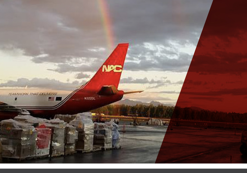 Photo of a NAC plane with a rainbow in the sky. 