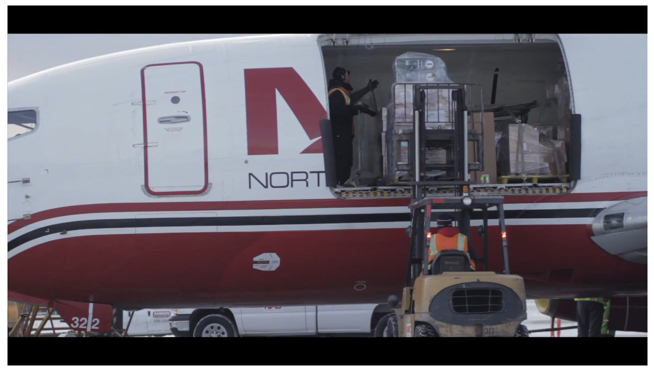 Cargo being loaded into a Northern Air Cargo plane. 